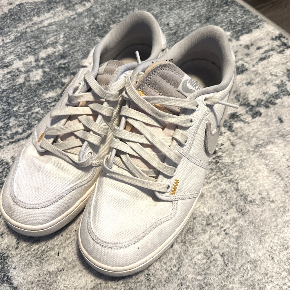 Nike  Ajko low mens sneakers, size 9. My son wore them 2-3 times only.